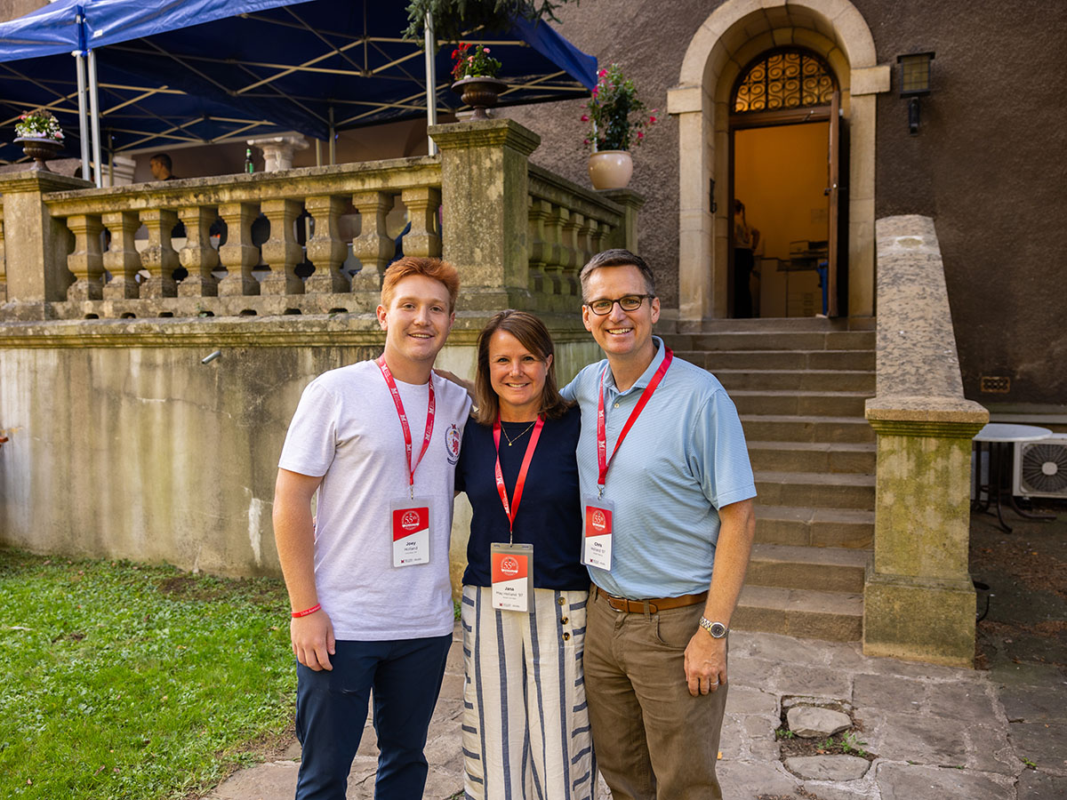 From left: Joey Holland, Jana Holland, and Chris Holland sharing a family moment outside the Chateau